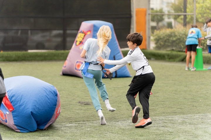 a group of people playing a game of football